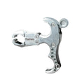 Close-up of a zinc alloy archery release aid showing its two-axis harpoon clip mechanism.