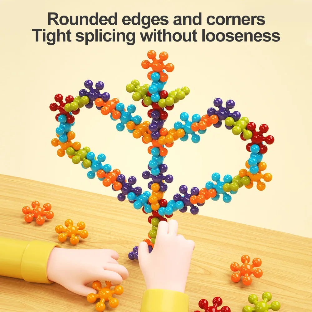 DIY plum blossom building blocks arranged in flower shape with rainbow colour pieces on white background