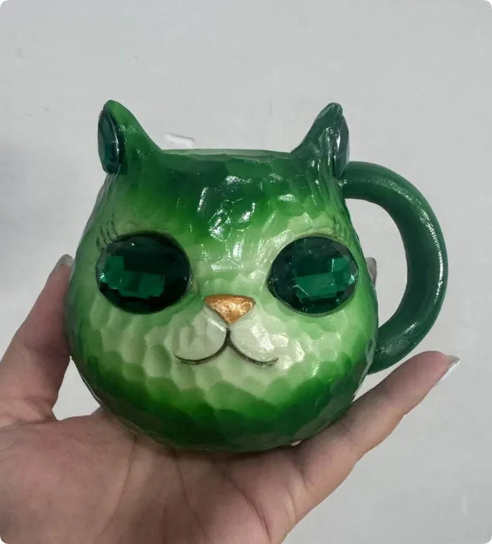 Resin crystal earth cat cup craft ornament in American style, shown in blue, green, pink, and purple colour options.