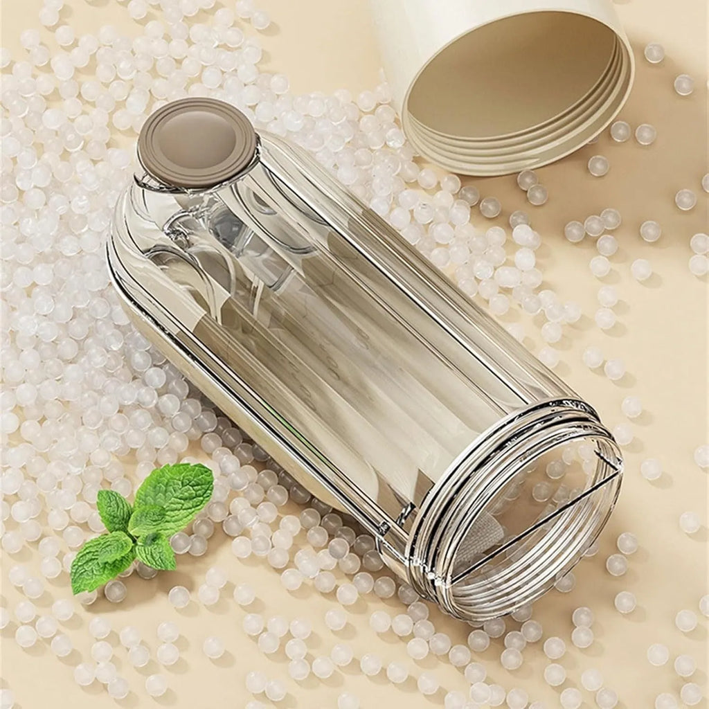 Beige and green foldable dog water bottle with food container, shown with press-to-dispense tray.