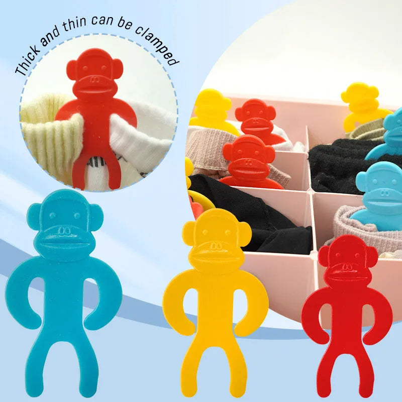 Plastic sock clips in blue, red and yellow colours for laundry organisation and machine washing