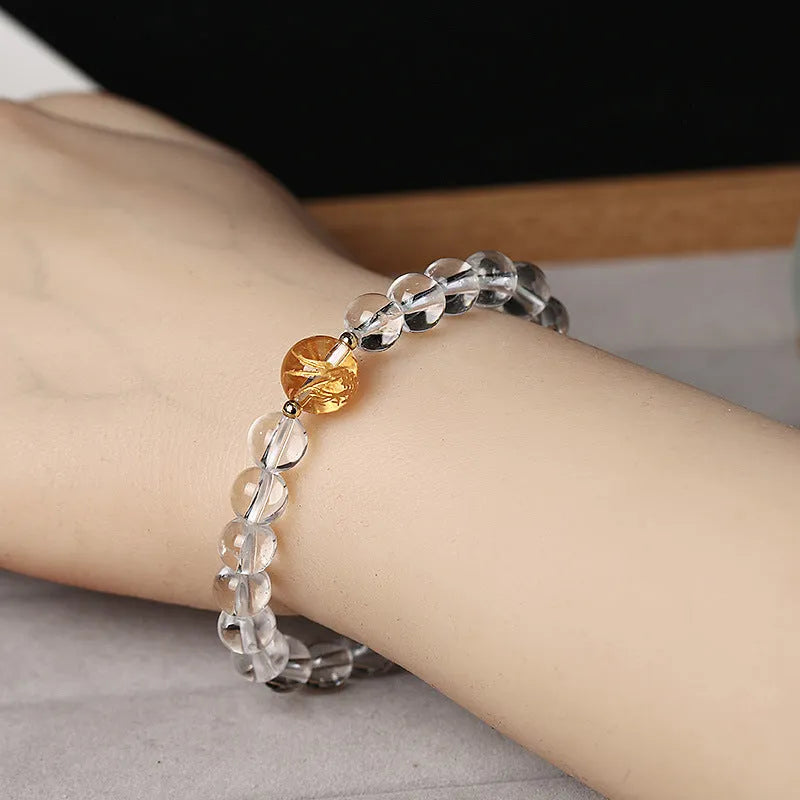Geometric unisex bracelet with obsidian, black agate, and white crystal beads and dragon charm