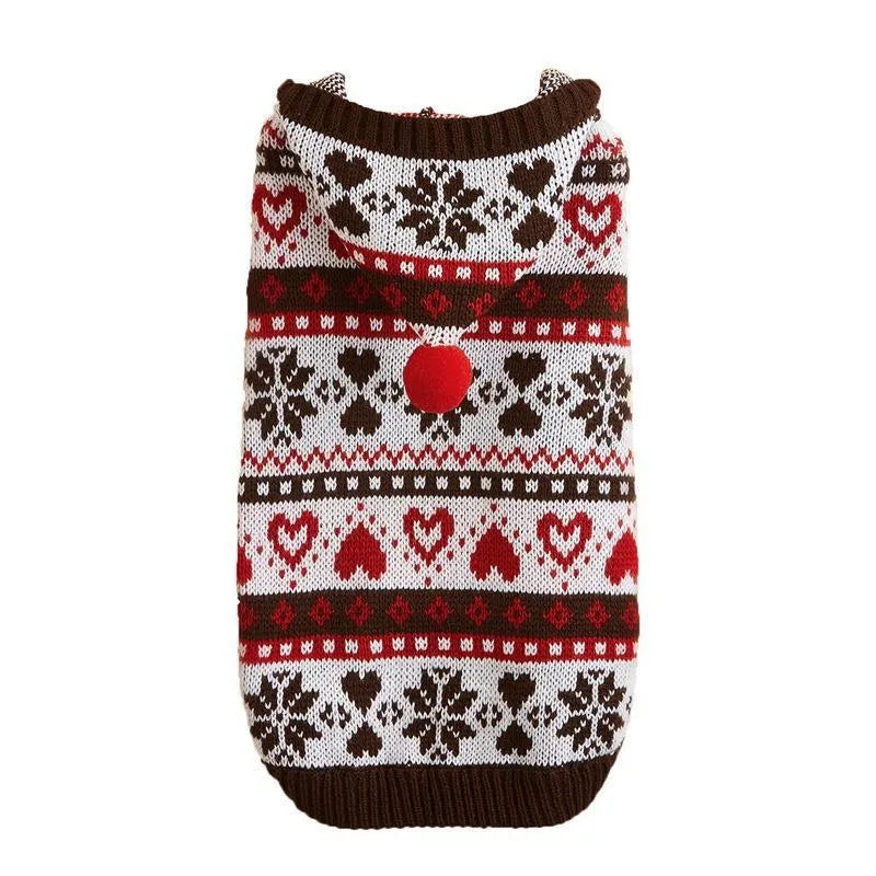 Blue knitted dog sweater with snowflake, love heart, and striped camouflage pattern on a small dog.