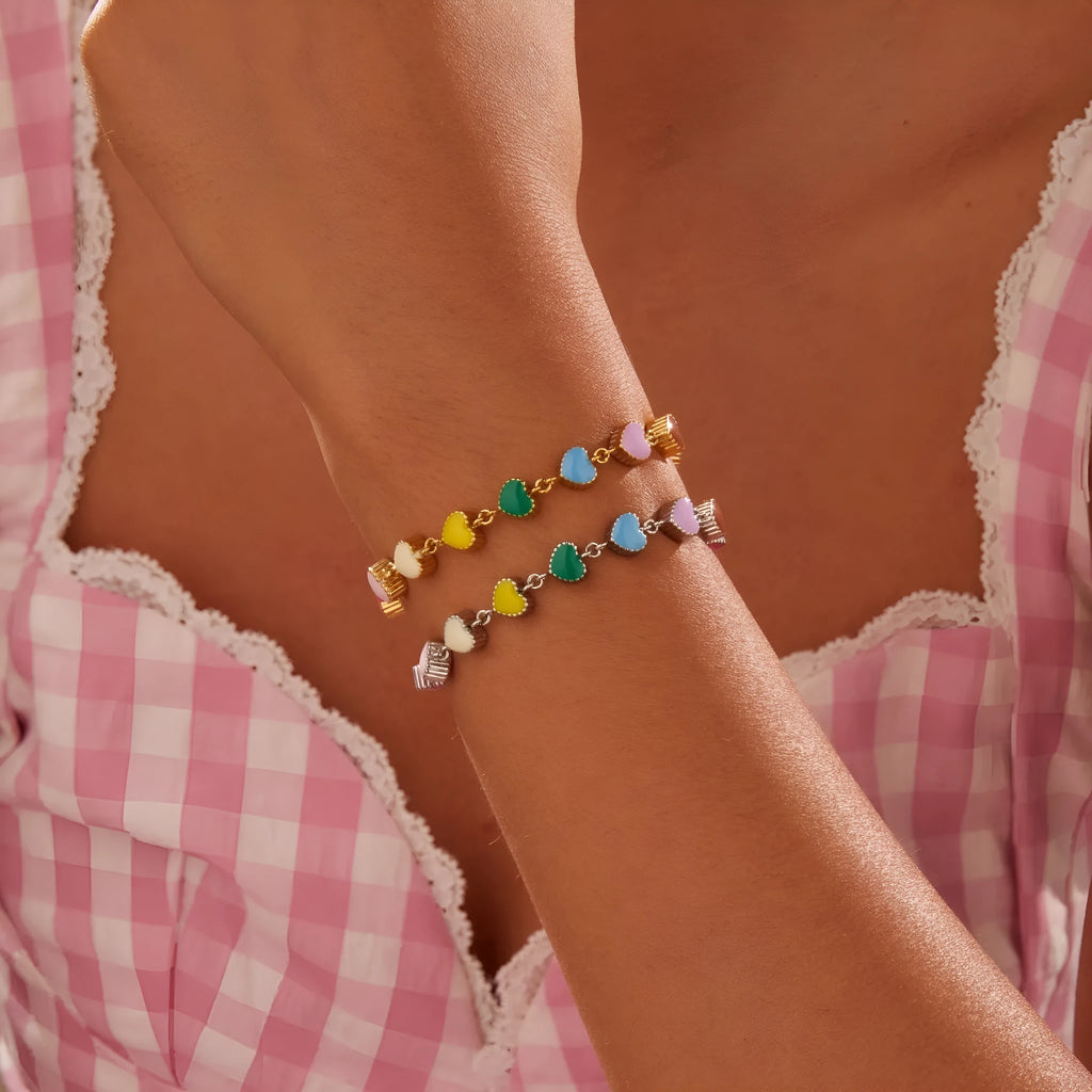 Women's stainless steel bracelet with love heart pendant in gold or steel finish