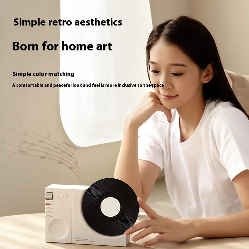 Mini Bluetooth portable speaker with card insertion slot in obsidian black, ivory white, coral pink, or plum green colour