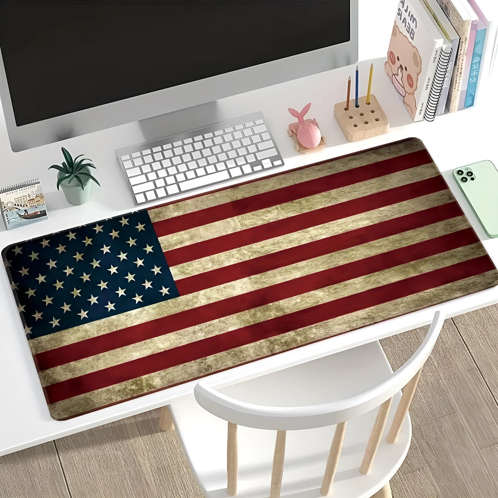 Large geometric pattern desk pad with natural rubber non-slip base on wooden desk