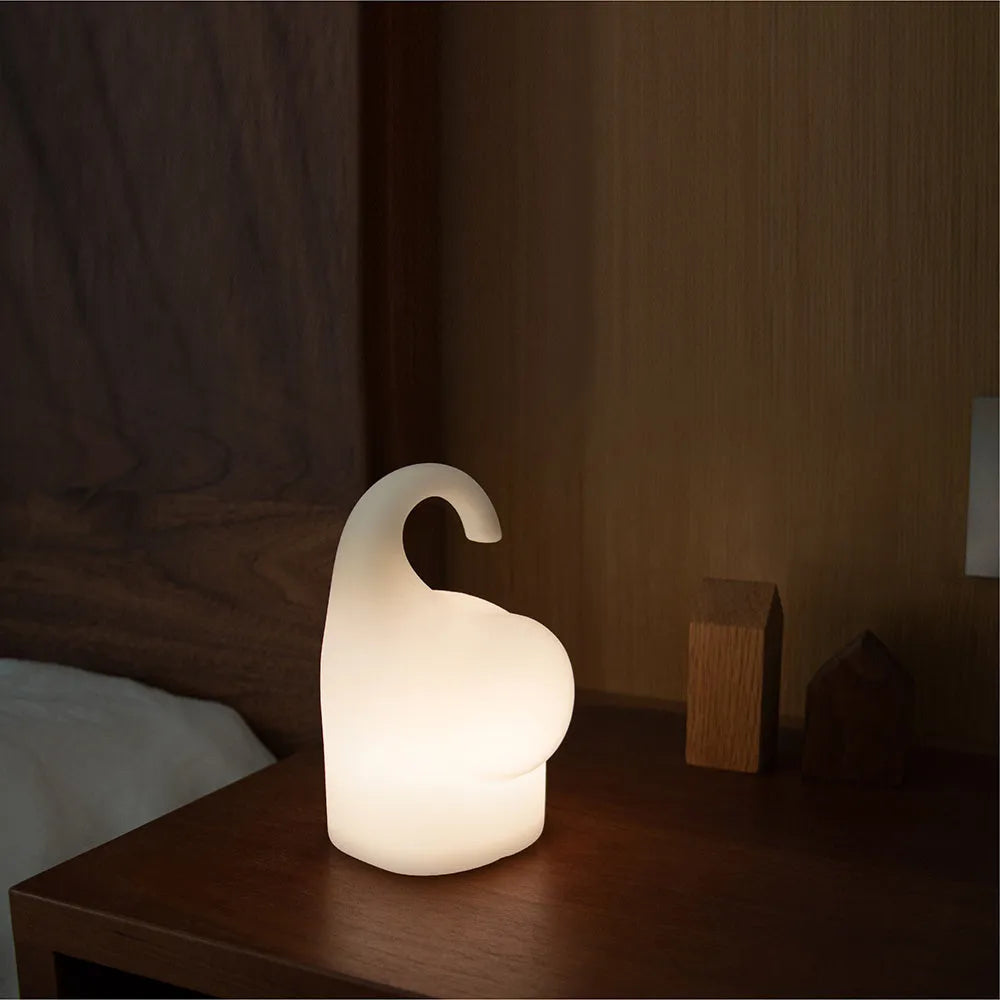 Elephant-shaped silicone night light with warm white LED illumination measuring 96mm wide by 151mm high