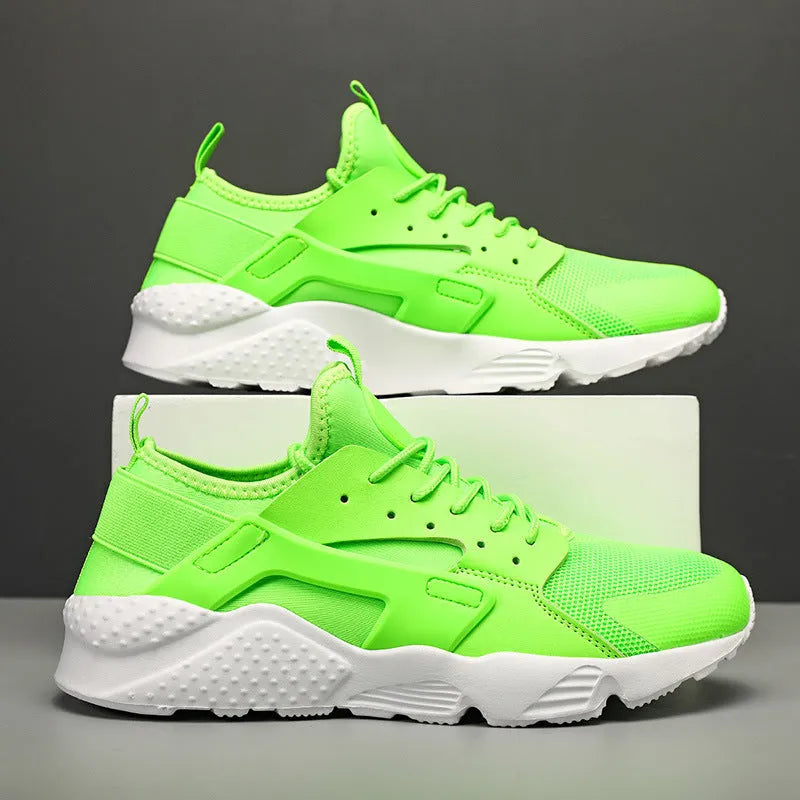 Men's green low top casual mesh shoes with cross shoulder straps and flat sole.