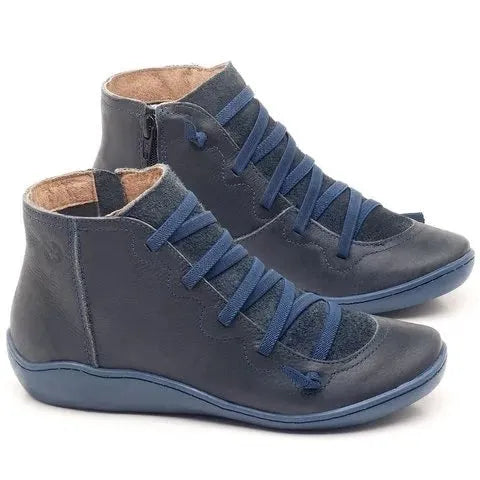 Women's casual ankle booties with flat wedge heel and round toe in various colours on a white background