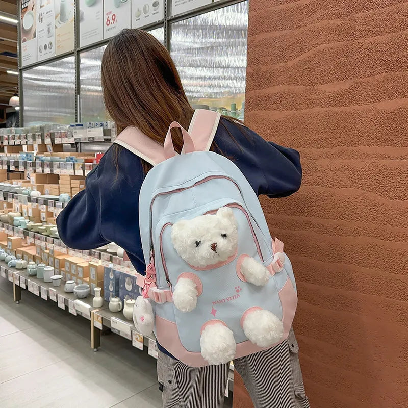 Nylon school backpack in macaron colour with curved shoulder strap and pendant, 20-35L capacity