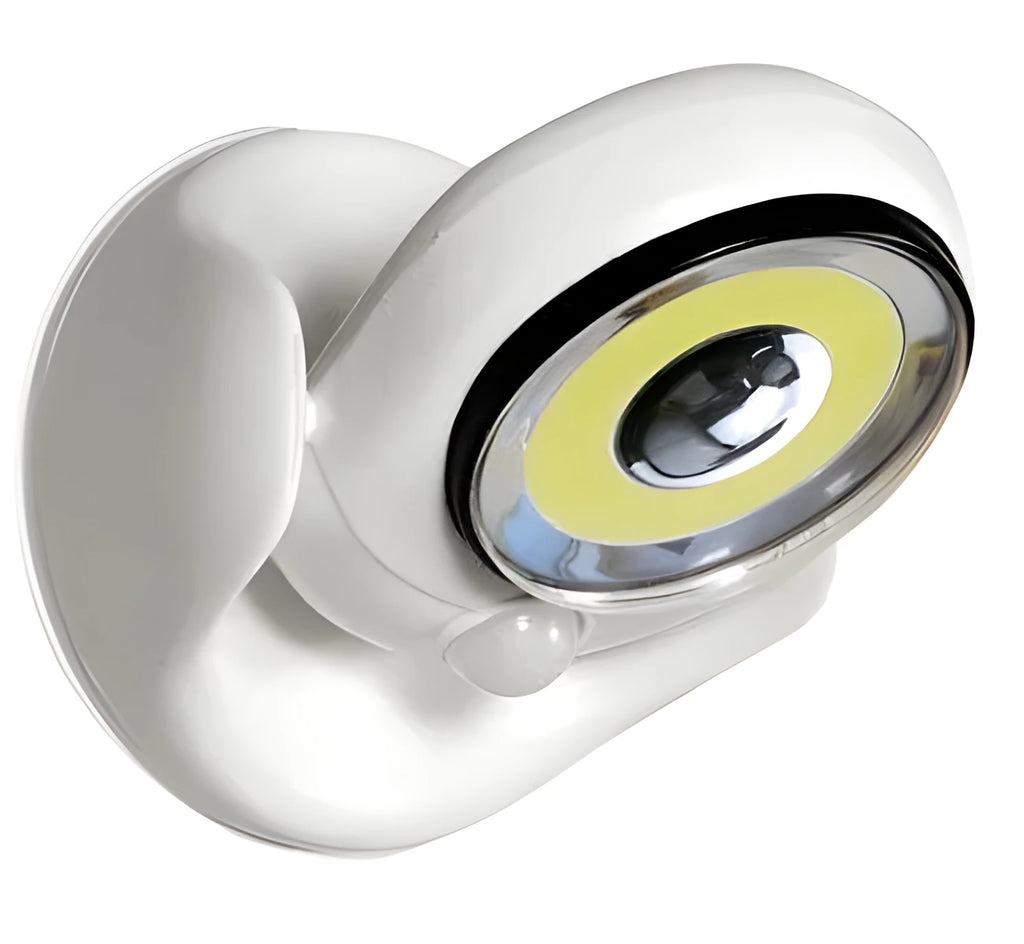White Atomic Angel cordless induction desk lamp on a surface.