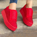 Women's black casual sneakers with rhinestone lace-up detail and a thick flat rubber sole.
