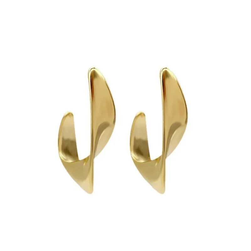 Metal twisted geometric hoop earrings with electroplated gold or silver finish showing round wire design