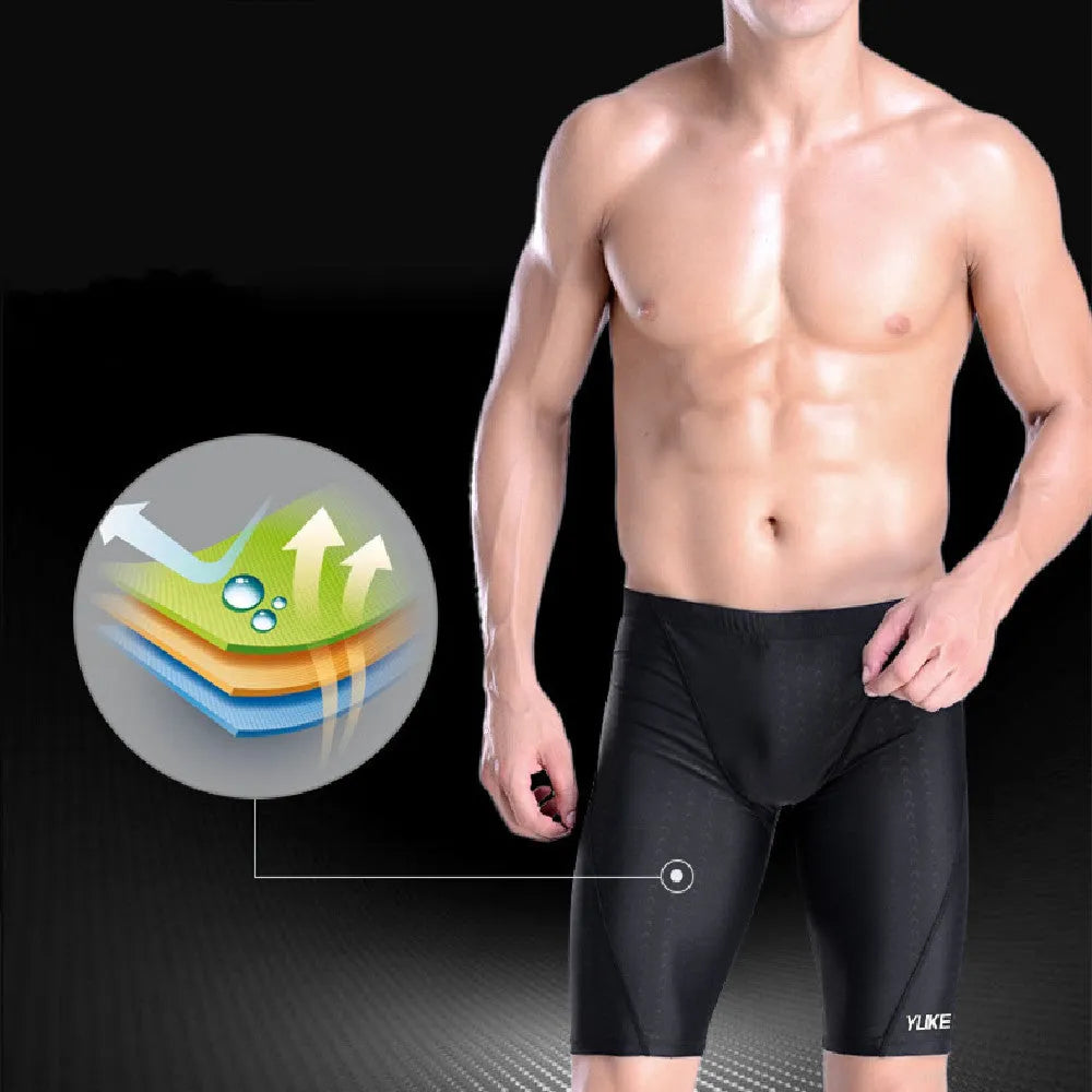 Men's black five-piece swimming set with trunks, anti-fog goggles, waterproof cap, ear plug nose clip, and storage bag