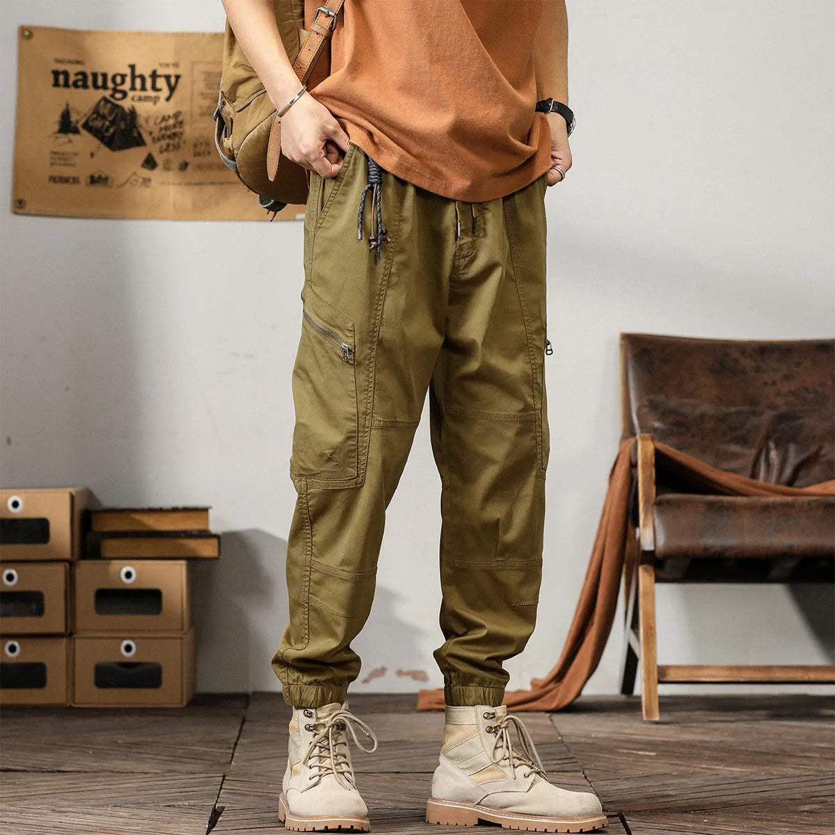 Men's cotton harem pants with ankle banded legs in khaki colour showing zip placket fly detail