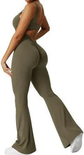 Woman wearing a sleeveless army green flare jumpsuit for yoga or fitness.