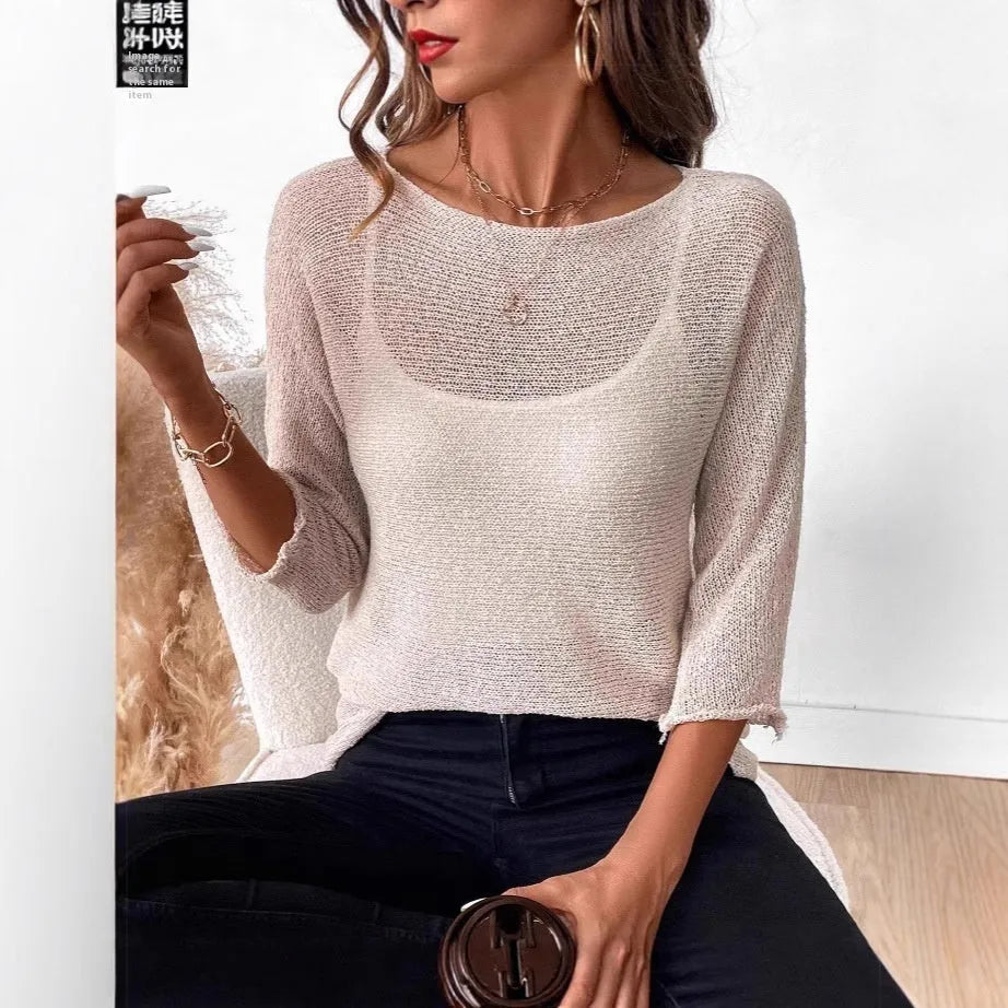 Women's off-shoulder knitted top in light blue with 3D pattern and 3/4 sleeves.