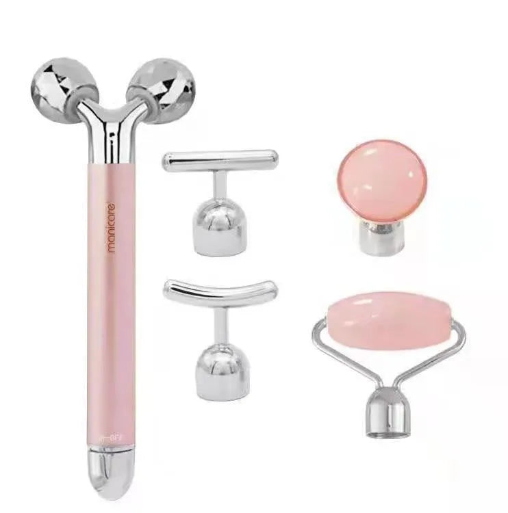Rose gold five-in-one vibrating face lifting machine with four interchangeable jade and beauty heads in a compact box