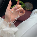 White bow pearl necklace for women with adjustable 31-40cm length and geometric design