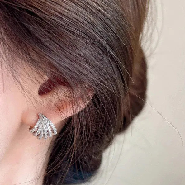Geometric zircon earrings with platinum electroplated finish and line design detailing