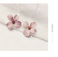 Women's flower stud earrings in alloy with electroplated white or pink finish