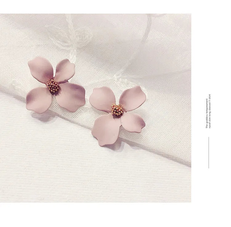 Women's flower stud earrings in alloy with electroplated white or pink finish