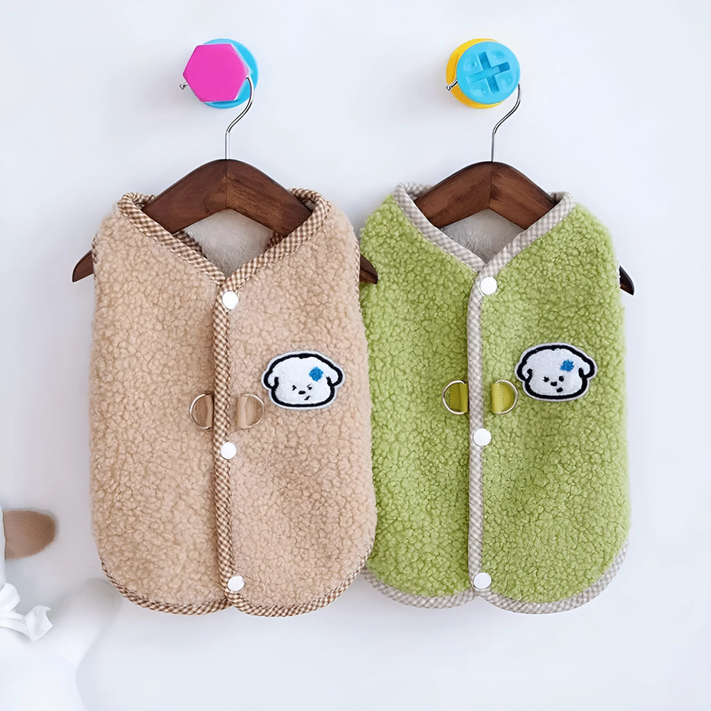 Green coral fleece dog vest with leash ring on small dog during autumn