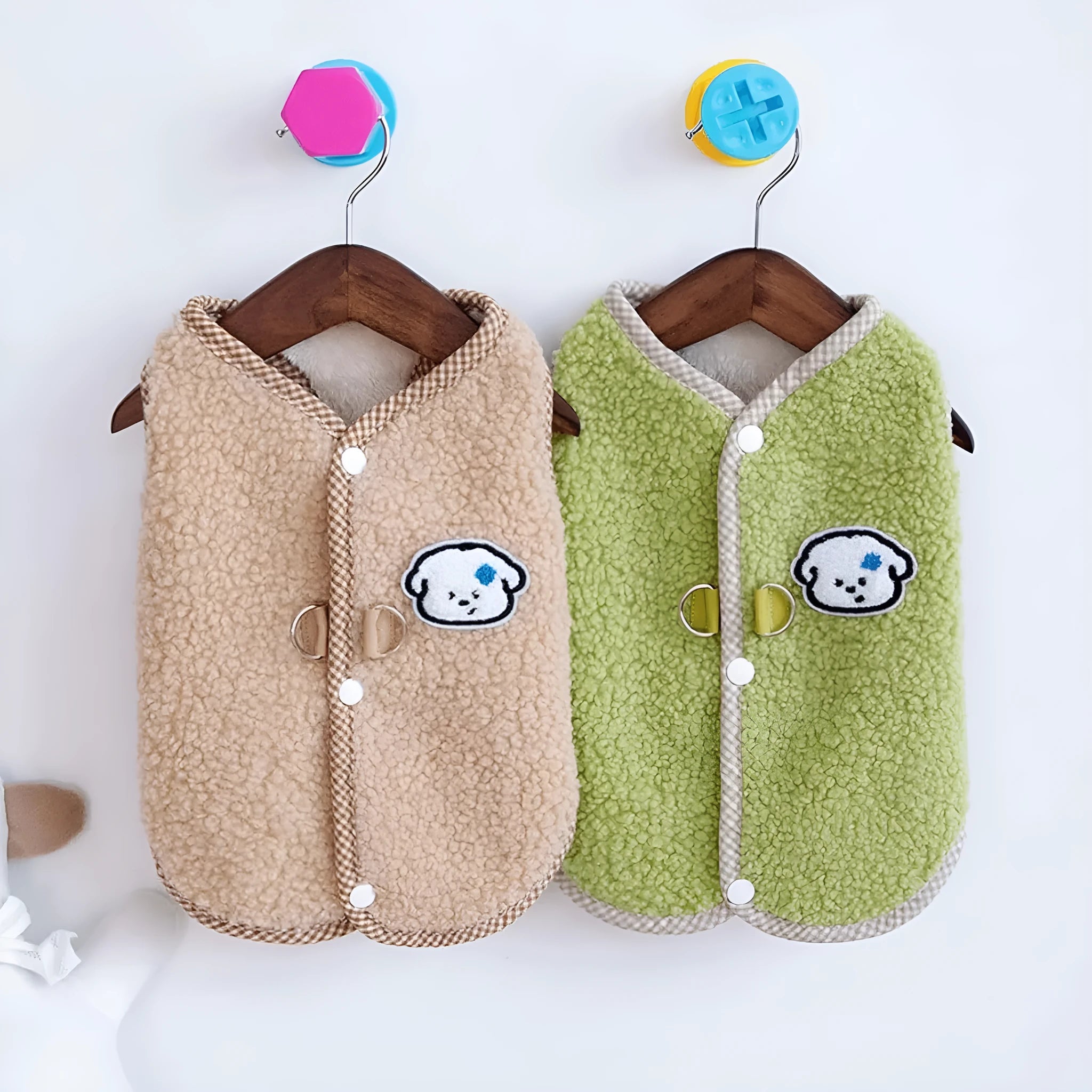 Green coral fleece dog vest with leash ring on small dog during autumn