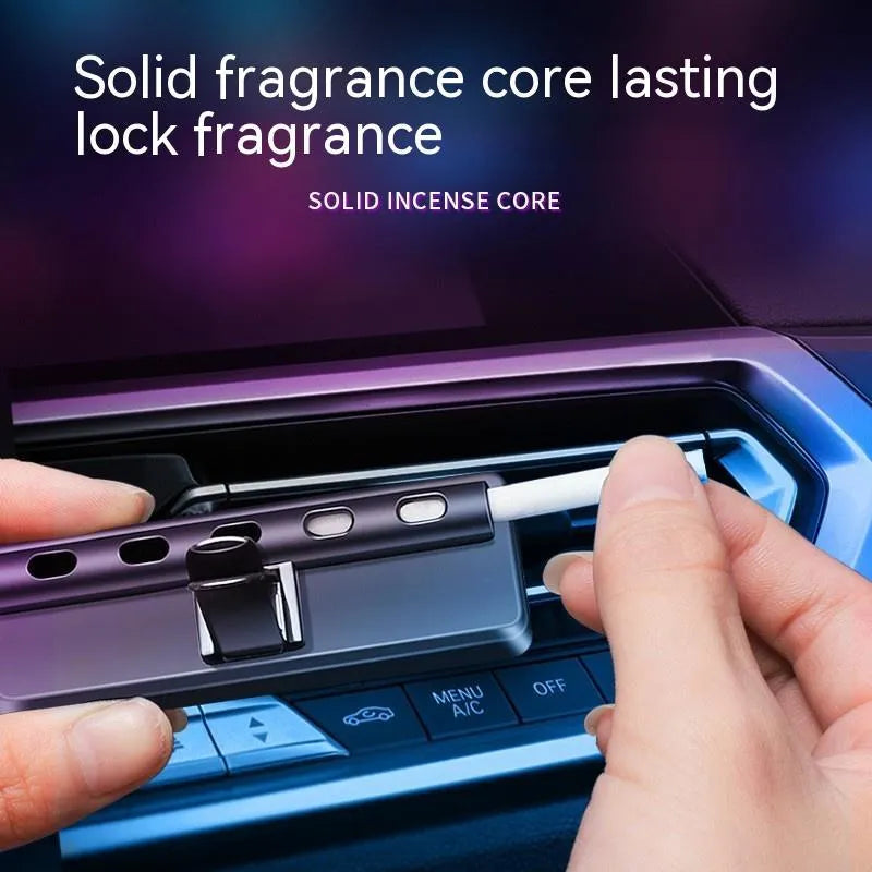 Black car air vent ambient light and perfume deodorizer with USB cable.