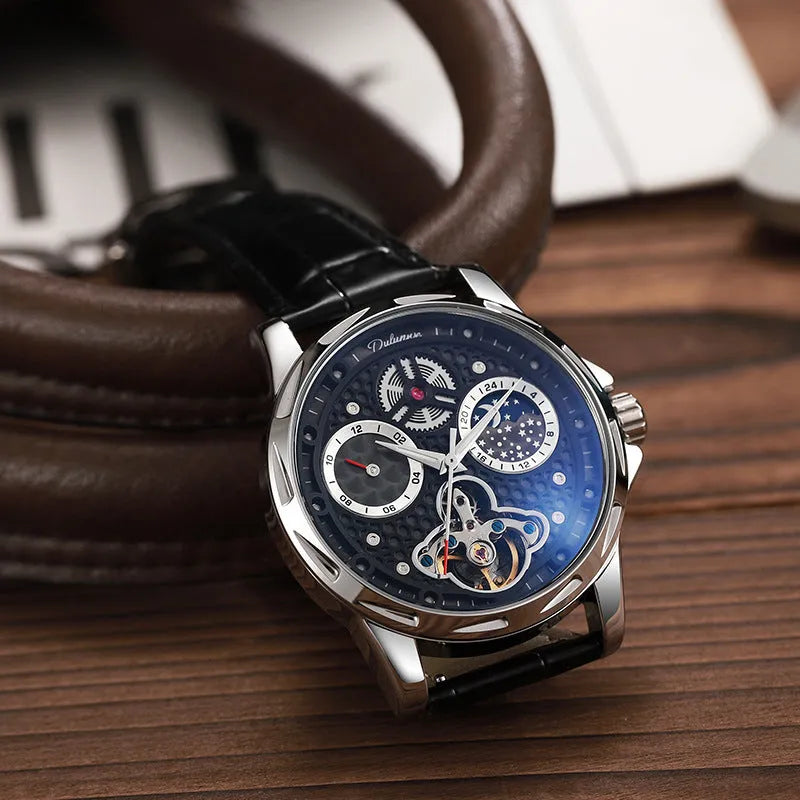 Men's automatic wristwatch with steel case, leather strap, black dial and luminous hands.