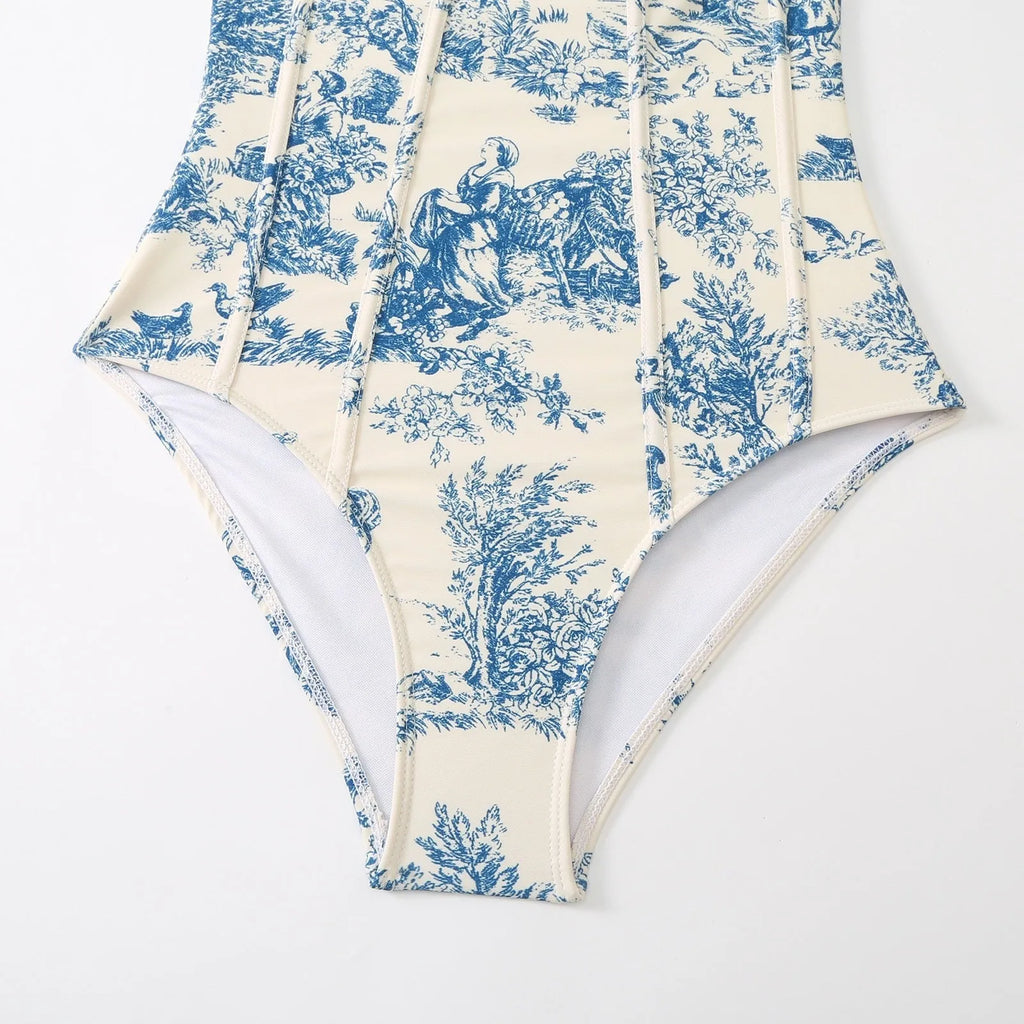 Blue patterned one-piece swimsuit for women with optional gauze skirt, shown on a model.