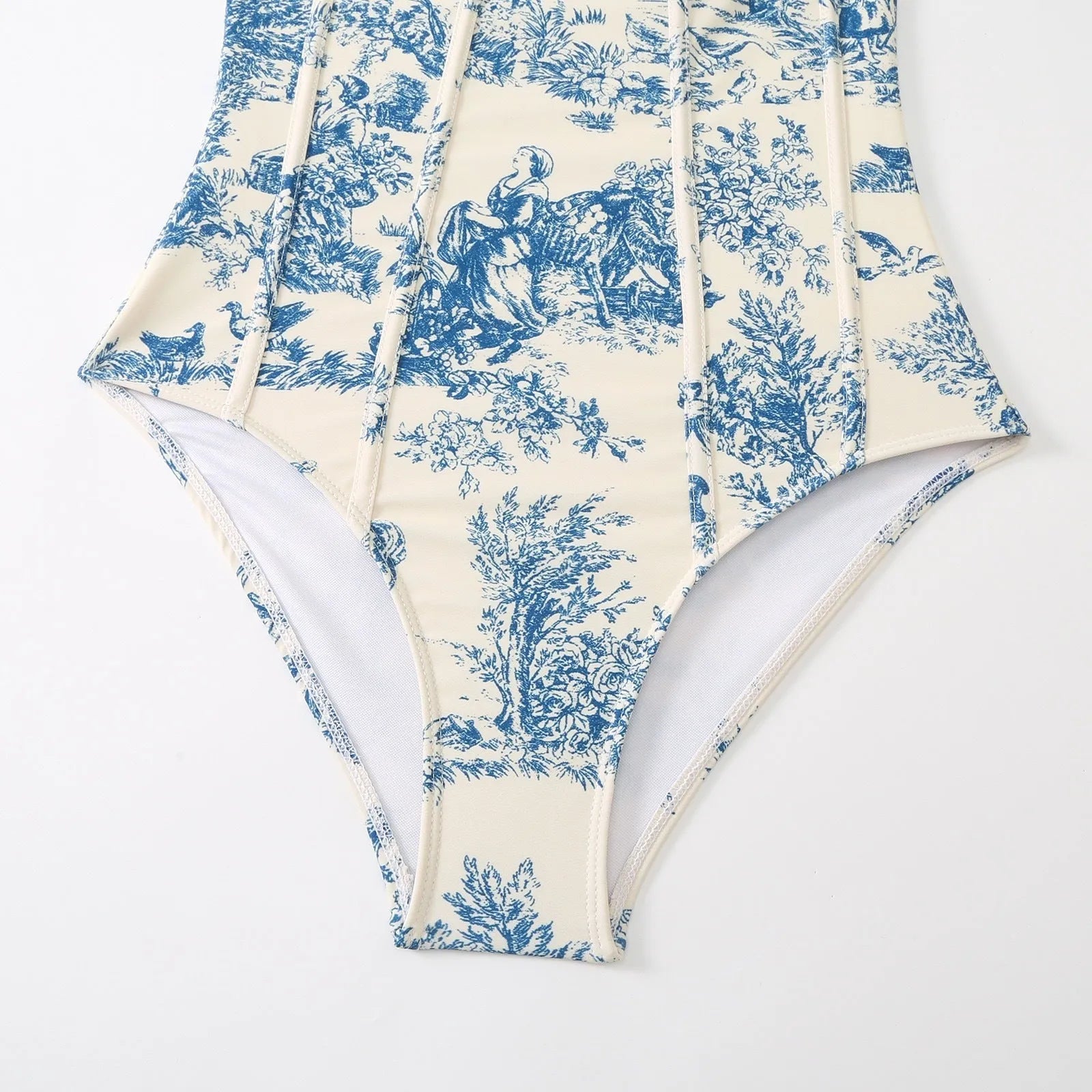 Blue patterned one-piece swimsuit for women with optional gauze skirt, shown on a model.