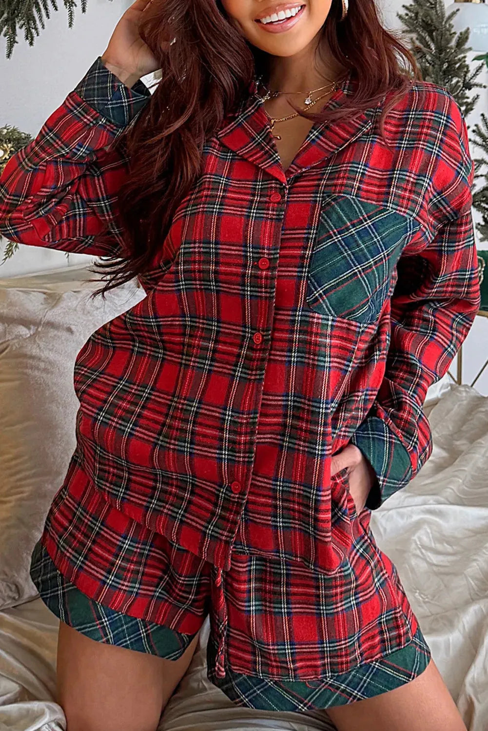 Red plaid Christmas pyjama set with contrast patches, showing long sleeve shirt and matching shorts