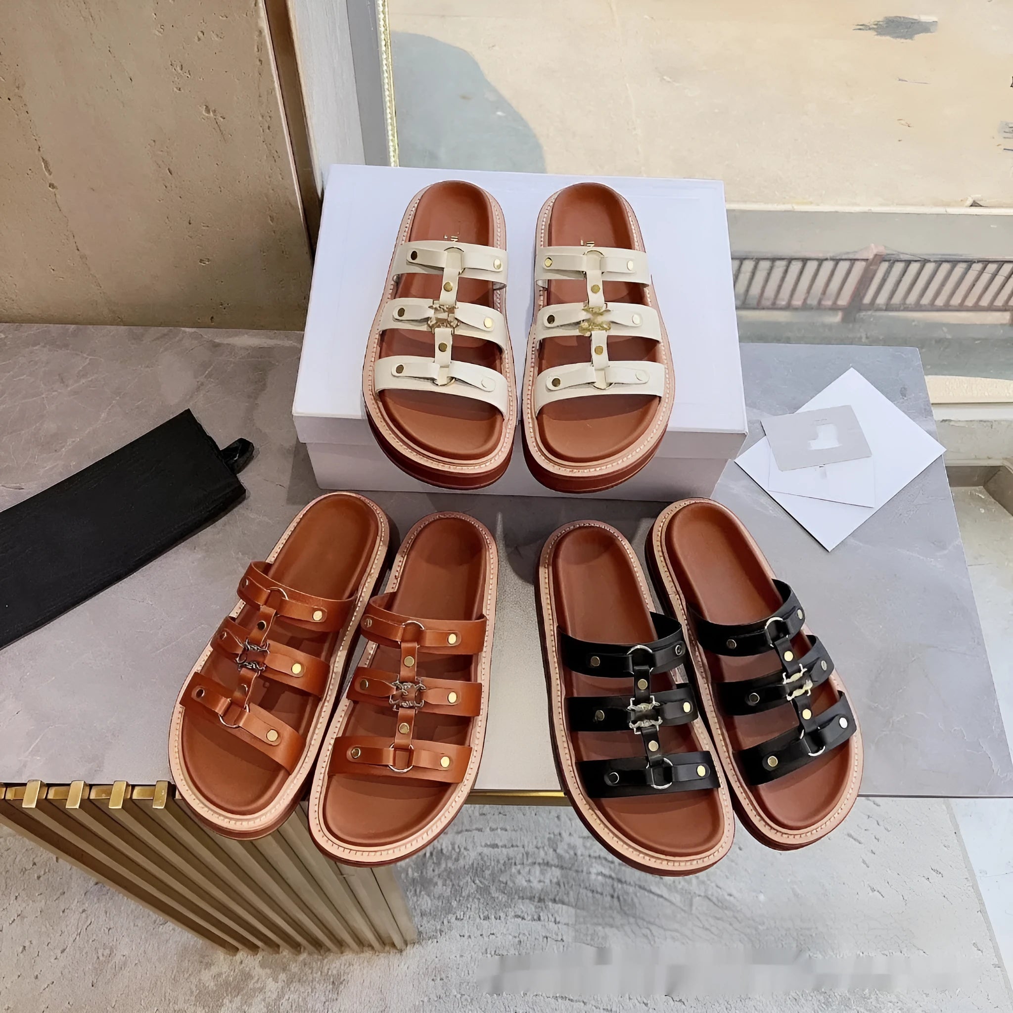 Women's black Roman-style sandal slippers made of glossy patent leather and soft sheepskin.