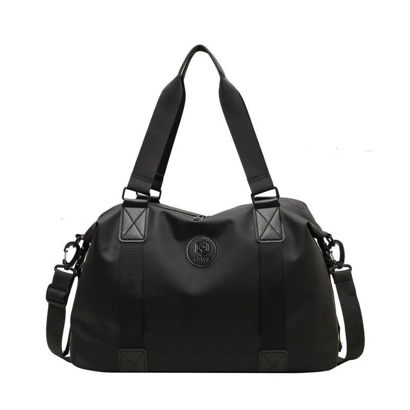 Large black waterproof travel backpack with multiple compartments shown opened to display interior organisation