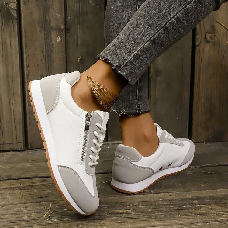 Women's flat-heeled shoes in artificial PU leather with rubber soles showing neutral colour options