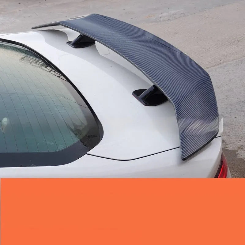 Universal punch-free car spoiler made from ABS plastic, shown in bright black finish.