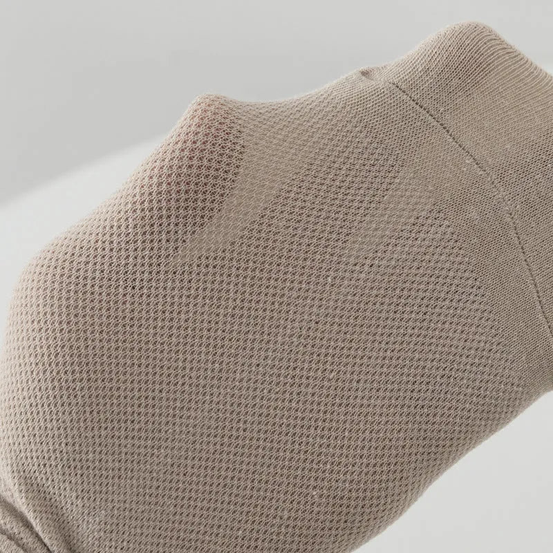 Pair of solid colour low-cut boat socks for men made from breathable polyester.