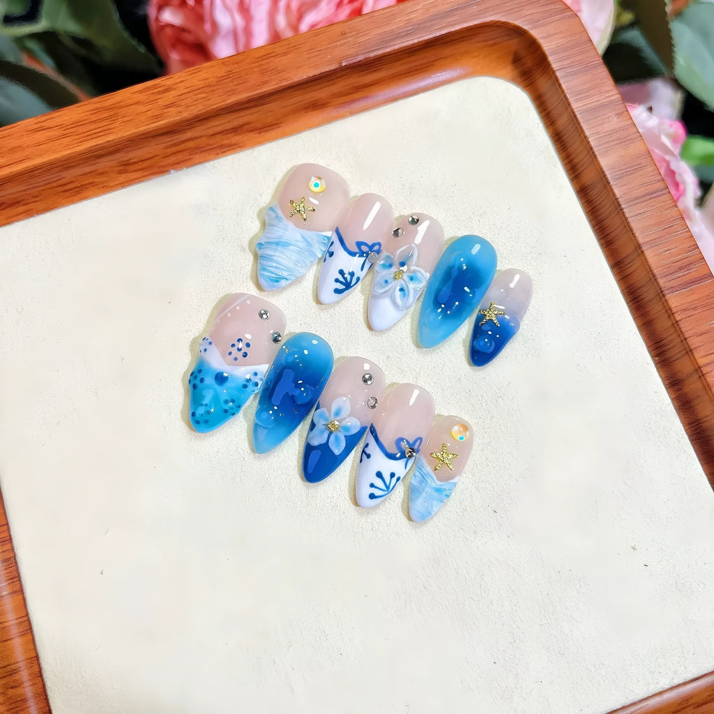 Blue hand-painted carved transparent plastic fake nails set in sizes XS to L
