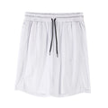 Man wearing loose-fitting black quick-dry mesh shorts with an elasticated waist.