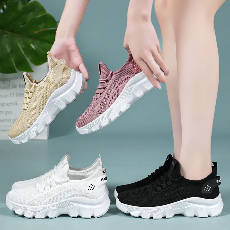 Women's white flyknit sneakers with round toe and flat PVC sole