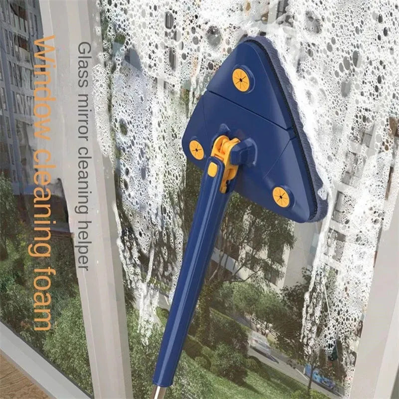Blue extendable triangle mop with rotating head and microfibre cloth on a tiled floor.