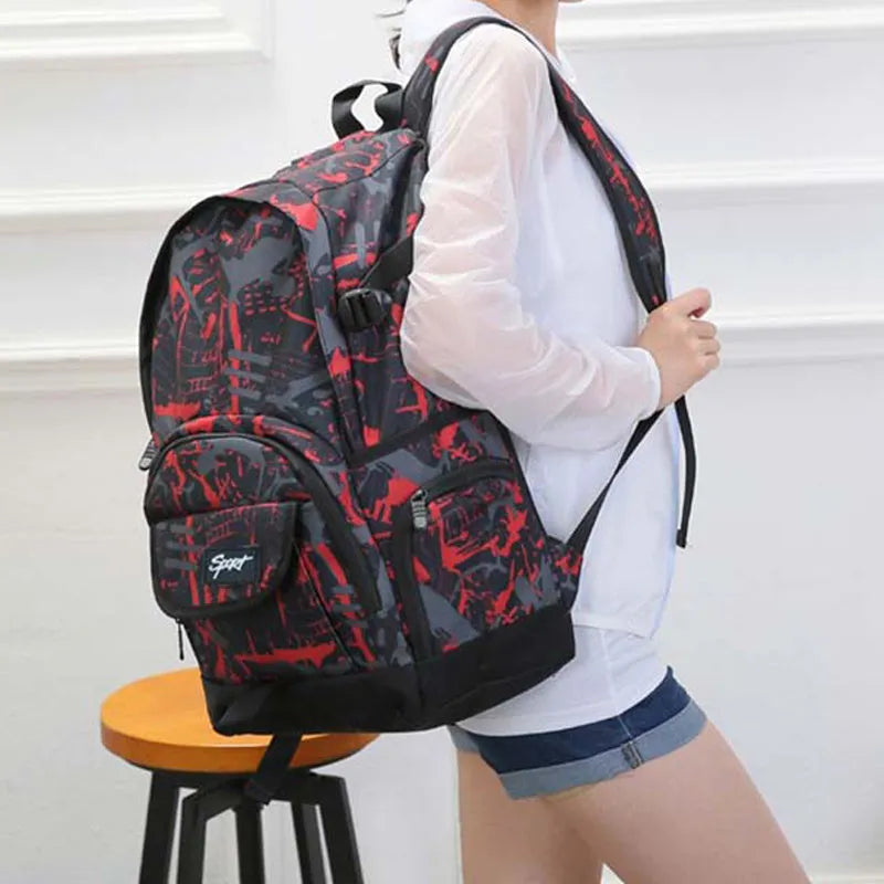 Classic blue nylon backpack with large main compartment and adjustable straps on a plain background.