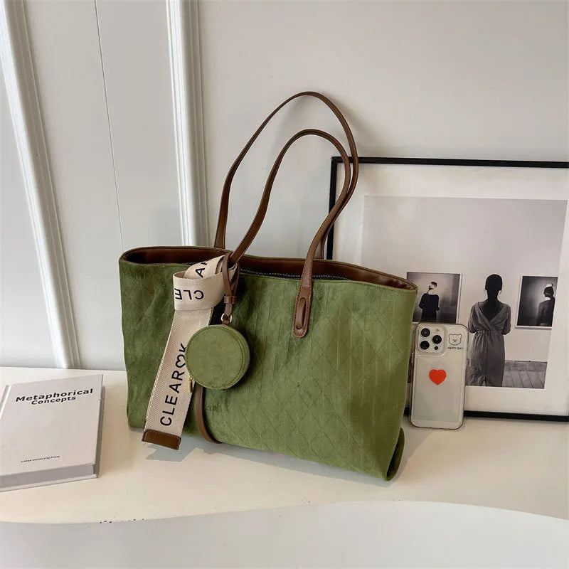 Soft green polyester large shoulder tote bag with horizontal square shape and a shoulder strap.