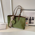 Soft green polyester large shoulder tote bag with horizontal square shape and a shoulder strap.