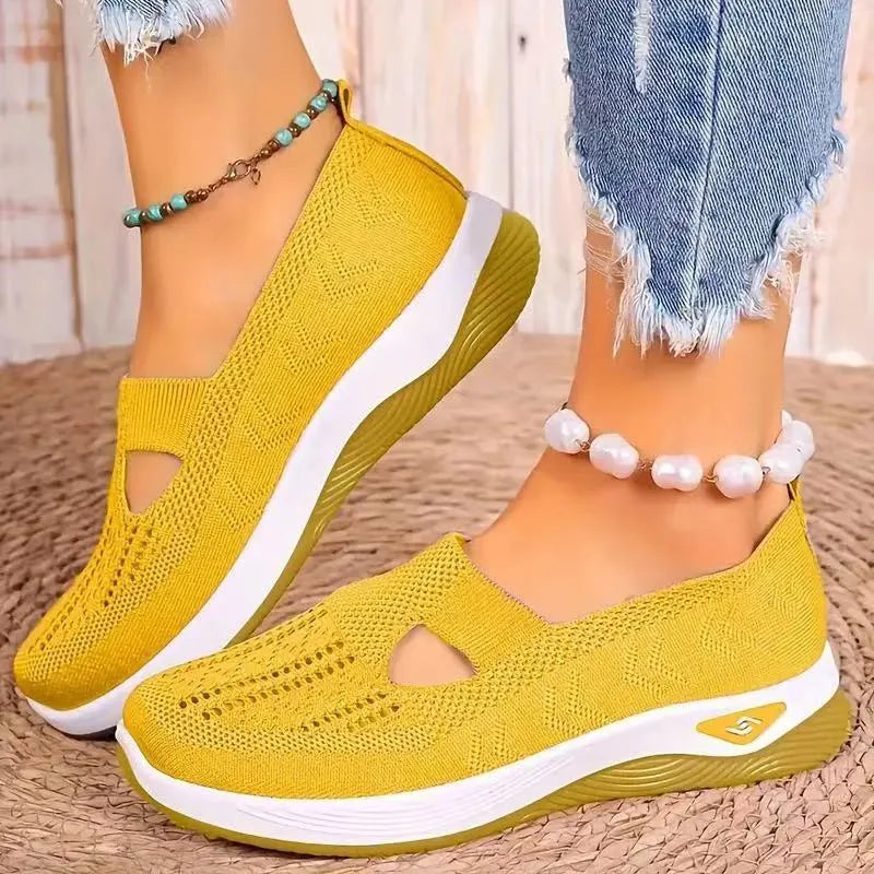 Women's casual mesh shoes with T-strap in various colours showing round toe and flat heel design