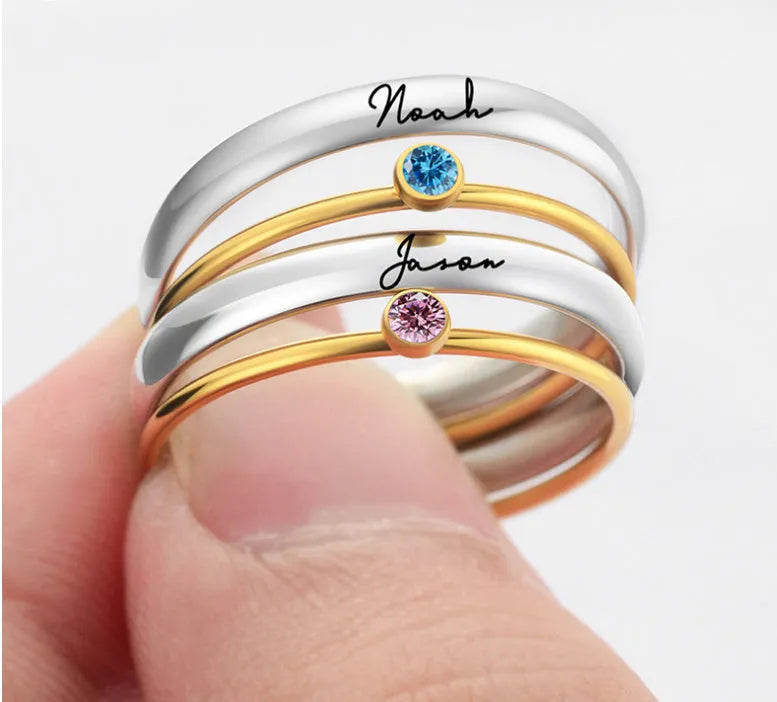 A geometric engraved titanium steel ring featuring a December birthstone colour.