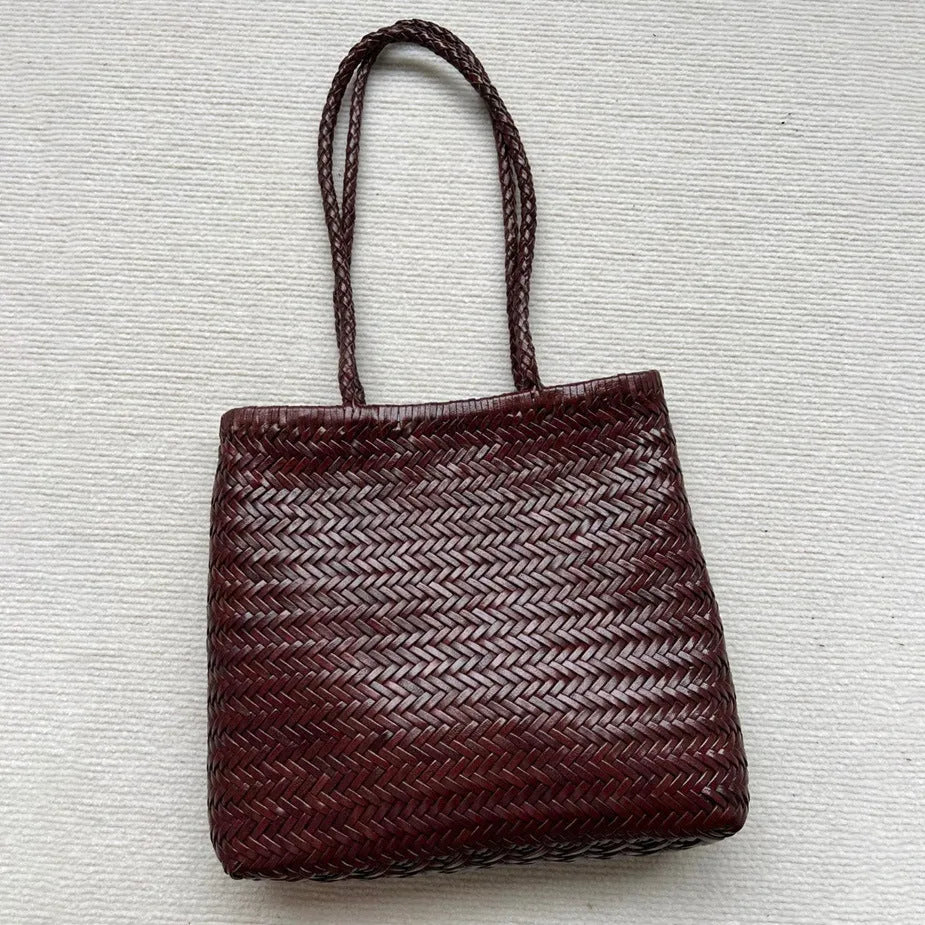 Brown woven leather tote bag with three-dimensional pockets measuring 27x30x6cm