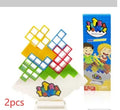 Plastic balance stacking game with 16 coloured building blocks on a chassis
