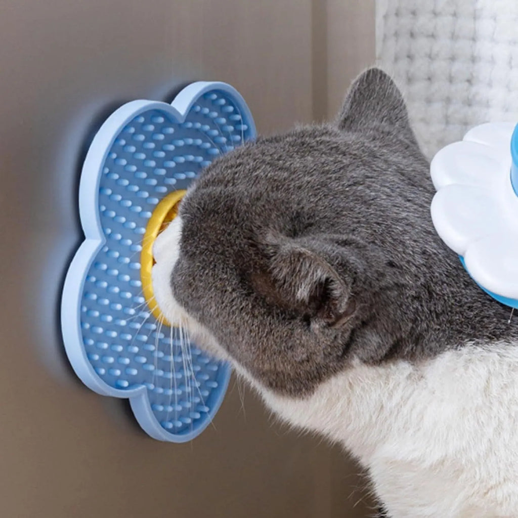 Flower-shaped silicone pet lick pad with suction cup base in assorted colours.